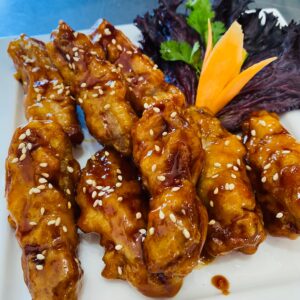 Chicken wings Harare honey spicy glaze Thai salad Moo Ka Thai