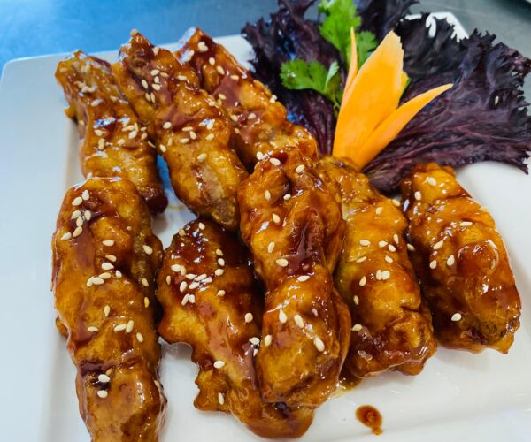 Chicken wings Harare honey spicy glaze Thai salad Moo Ka Thai
